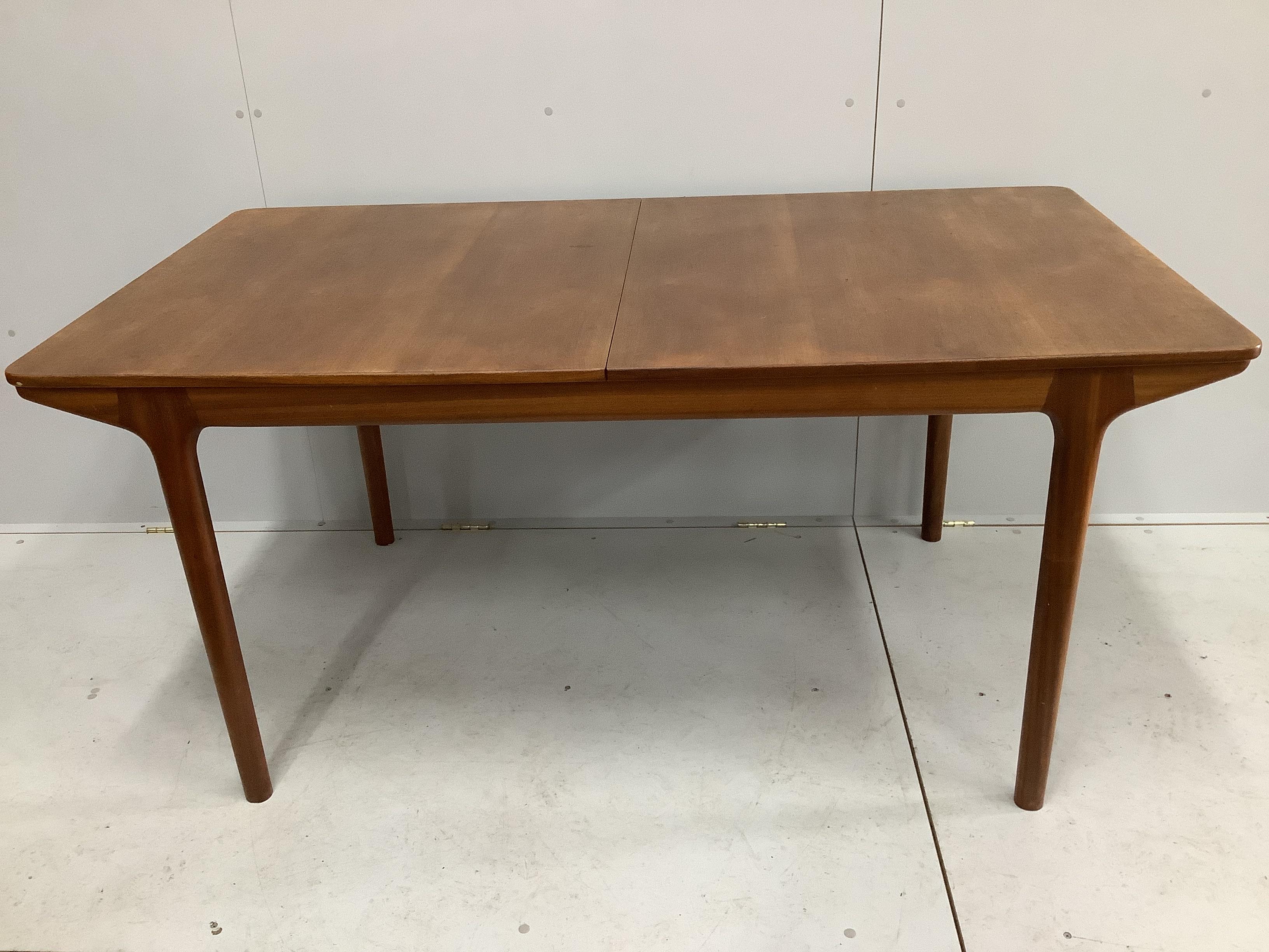 McIntosh of Kirkcaldy, a mid century teak dining suite comprising sideboard, width 213cm, depth 47cm, height 75cm, extending dining table and four chairs